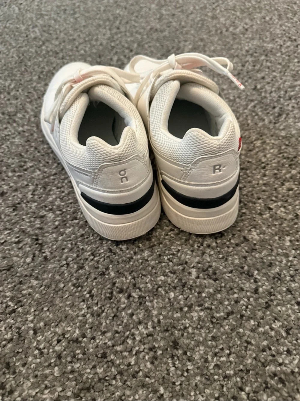 On Running White Sneakers with Red Accent